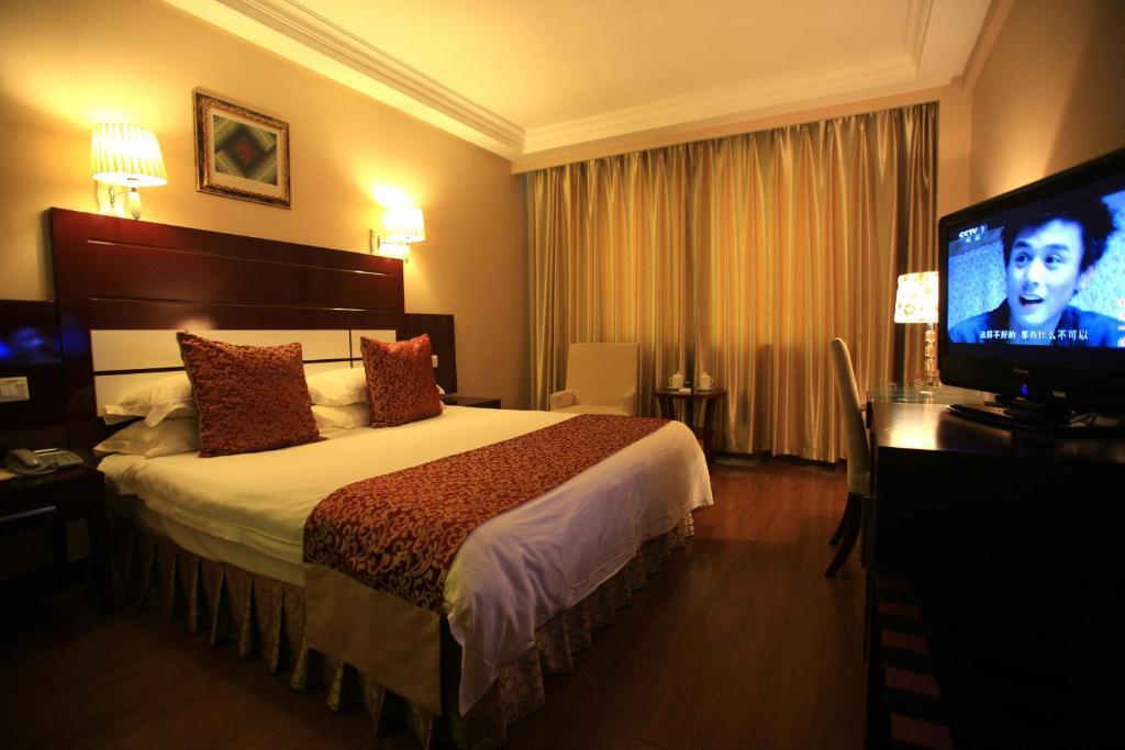 Overseas Chinese International Hotel Qingdao Værelse billede